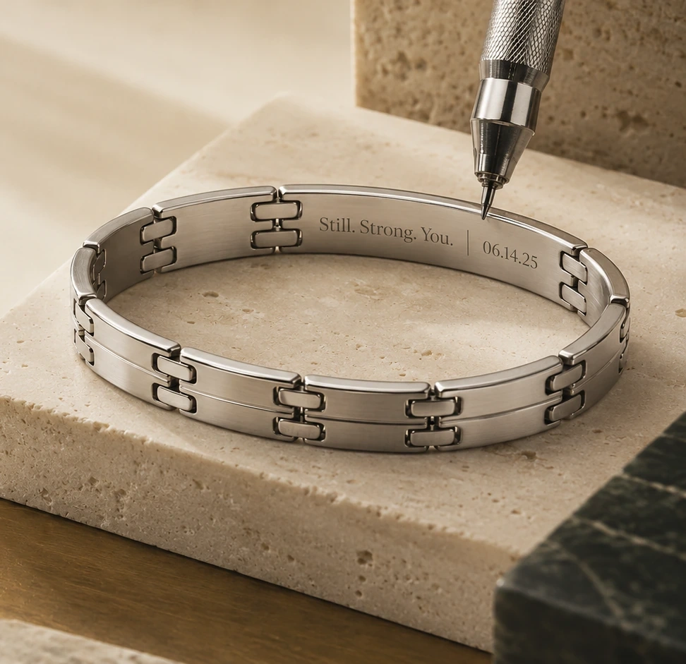 Stainless steel bracelet shown with custom engraving in progress